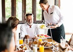 waiter giving order to the customers.